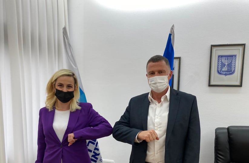 Health Minister Yuli Edelstein is seen standing alongside gym forum chairwoman Stella Weinstein. (photo credit: Courtesy)