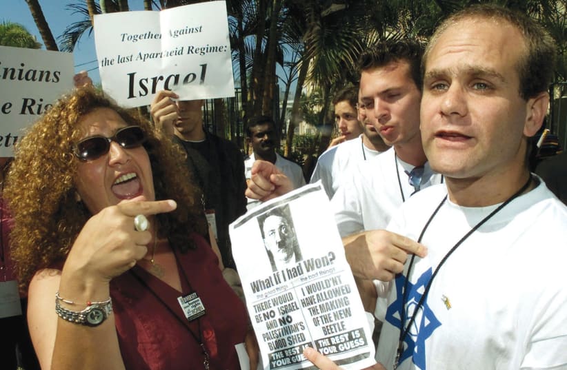 ARGUMENTS FLARE outside the 2001 World Conference Against Racism in Durban, South Africa, infamous for equating Zionism with racism. (photo credit: MIKE HUTCHINGS / REUTERS)