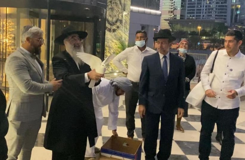 Rabbis and Imams release doves of peace at the Isra Dubai Business Forum, December 16, 2020 (photo credit: ISRA DUBAI CONFERENCE)