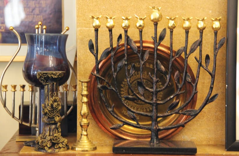 A menorah is seen inside the house of Davide Toledano, a businessman who heads Rabat's small Jewish community in Morocco, December 11, 2020 (photo credit: REUTERS/SHEREEN TALAAT)