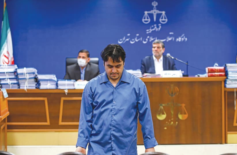 Ruhollah Zam is seen during his trial in Tehran on June 2. (photo credit: MIZAN NEWS AGENCY/WANA (WEST ASIA NEWS AGENCY) VIA REUTERS)
