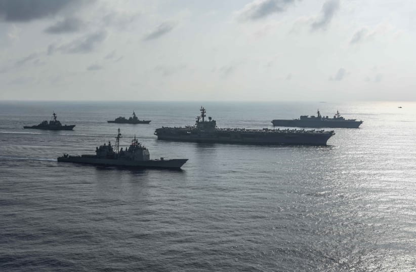 The US Navy aircraft carriers conduct a photo exercise with the Japan Maritime Self-Defense Forces in the South China Sea August 31, 2018 (photo credit: MASS COMMUNICATION SPECIALIST 2ND CLASS KAILA V. PETER/U.S. NAVY/HANDOUT VIA REUTERS)