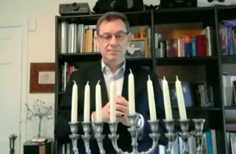 Pfizer CEO Albert Bourla lit the 7th nigh candle of Hanukkah (photo credit: SCREEN CAPTURE/ISRAEL EMBASSY IN WASHINGTON DC)