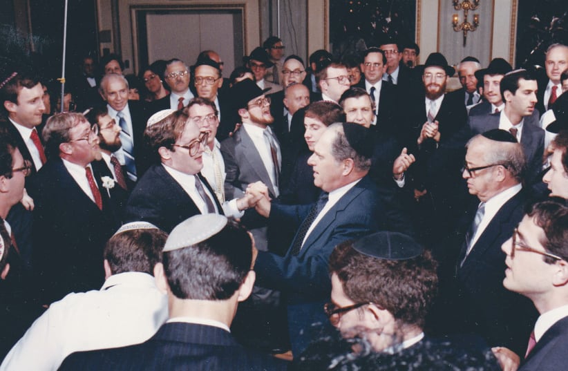 RABBI FABIAN SCHONFELD (center right) dances with Rabbi Kenneth Brander (center left) at his wedding. (photo credit: JERRY MEYERS STUDIO)