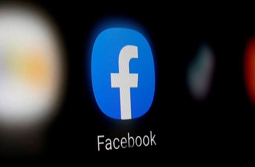  A Facebook logo is displayed on a smartphone in this illustration taken January 6, 2020 (photo credit: REUTERS/DADO RUVIC)