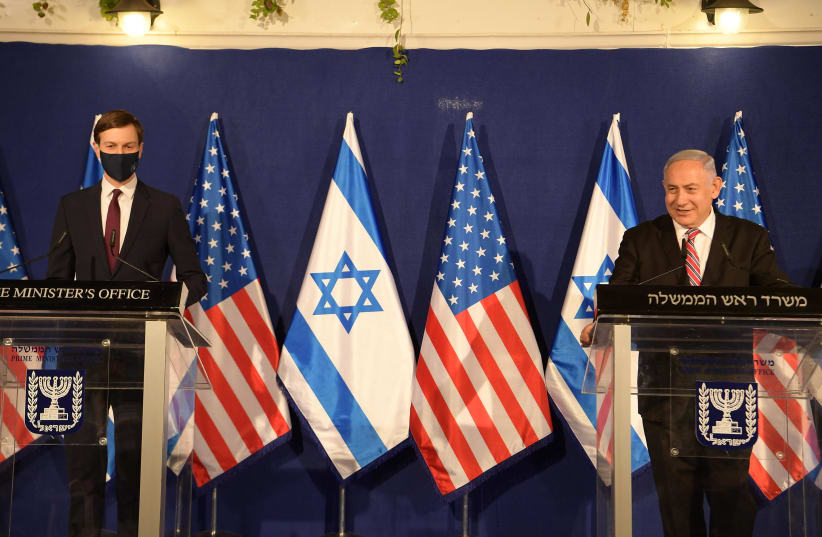 Special Advisor to US President Donald Trump Jared Kushner speaks alongside Prime Minister Benjamin Netanyahu, Jerusalem, December 21, 2020 (photo credit: AMOS BEN-GERSHOM/GPO)