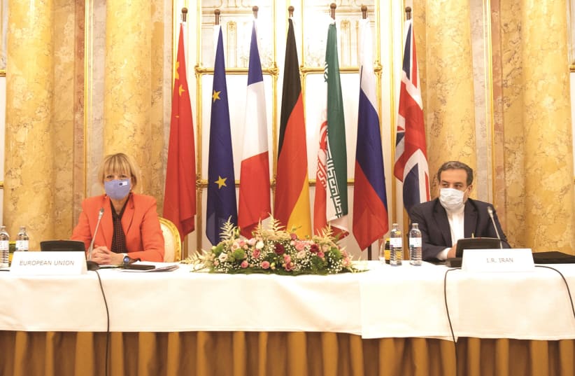 Iran’s top nuclear negotiator Abbas Araqchi and European External Action Service (EEAS) Secretary General Helga Schmid attend a meeting of the JCPOA Joint Commission in Vienna, Austria, September 1, 2020.  (photo credit: REUTERS)