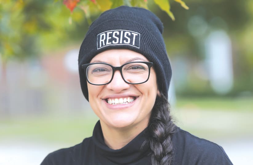 REP. RASHIDA TLAIB (D-Michigan) prepares to knock on doors in Detroit in October to encourage residents to vote in the US presidential election. (photo credit: REBECCA COOK / REUTERS)
