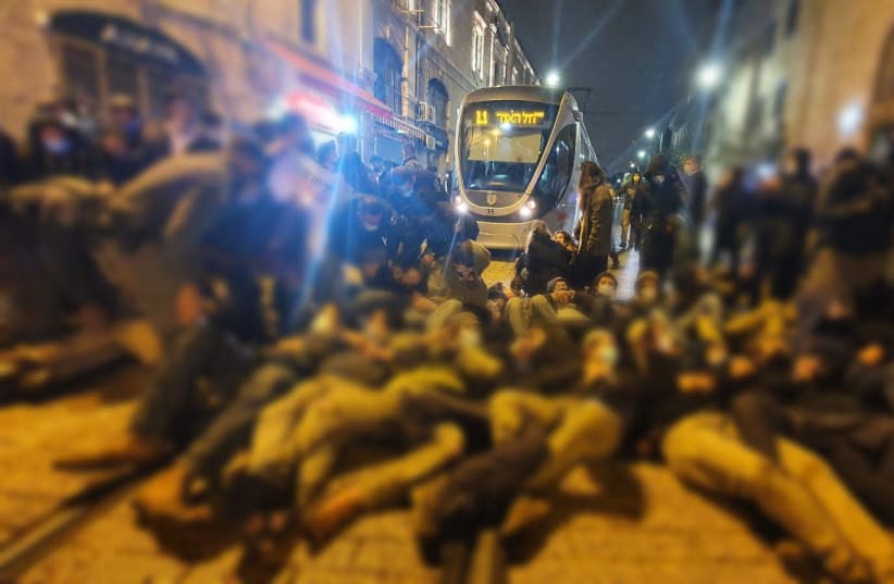 Demonstrators block light rail in Jerusalem in protest against death of Ahuvia Sandak, a hilltop youth member. (photo credit: ISRAEL POLICE)