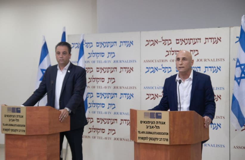 Yesh Atid MK Ofer Shelah with attorney Roi Cohen at the press conference at Tel Aviv's Beit Sokolow, December 24, 2020.  (photo credit: Courtesy)