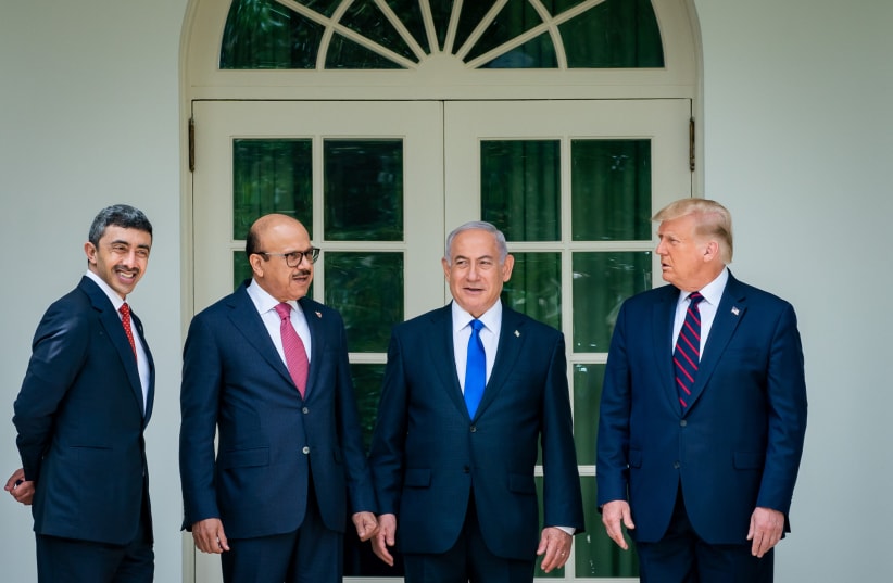 From left to right: UAE Foreign Minister Abdullah bin Zayed Al Nahyan, Bahrain Foreign Minister Abdullatif bin Rashid Al Zayani, Israeli Prime Minister Benjamin Netanyahu and President Donald Trump at the signing ceremony for the agreements on "normalization of relations" reached between Israel, the (photo credit: THE WHITE HOUSE)
