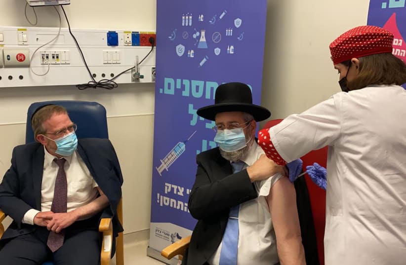 Chief Rabbi David Lau receives the coronavirus vaccine at Shaare Tzedek Medical Center in Jerusalem (photo credit: Courtesy)