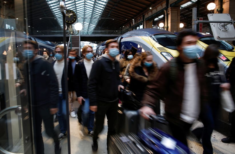 Passengers arrive at the Eurostar terminal at Gare du Nord train station, amidst the coronavirus disease (COVID-19) pandemic, in Paris, France December 23, 2020.  (photo credit: REUTERS)