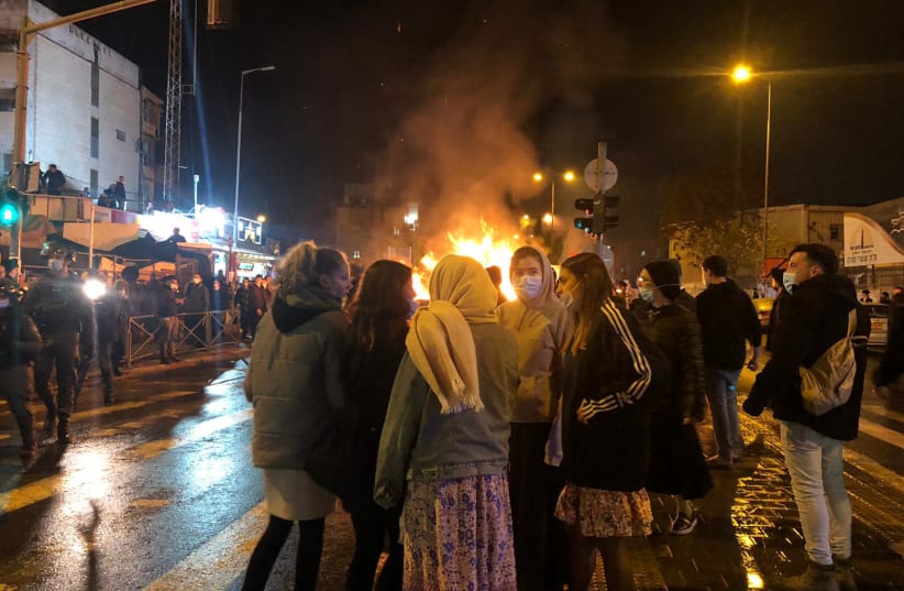 Protestors demonstrate over the death of Ahuvia Sandak on Monday night at Bar Ilan Junction.   (photo credit: MAARIV)