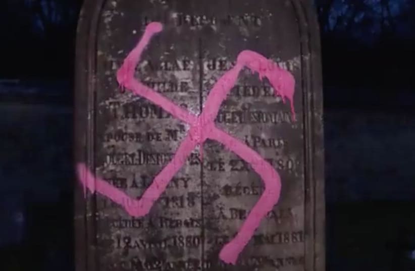 French cemetery desecrated in Fontainebleau, by swastikas, but not in the Jewish quarter (photo credit: AFP FILES / AFP)