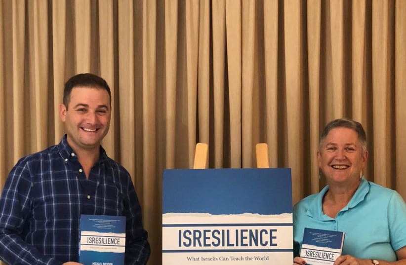 Authors Michael Dickson and Dr. Naomi L. Baum with copies of their new book. (photo credit: ISRAELNEWSTAND)