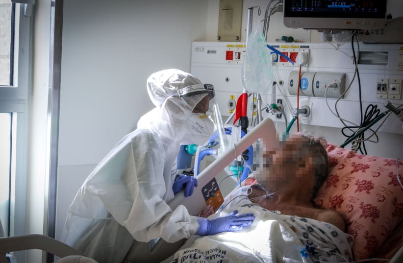 TREATING THE virus at Shaare Tzedek Medical Center’s corona unit, Jerusalem. (photo credit: MARC ISRAEL SELLEM)
