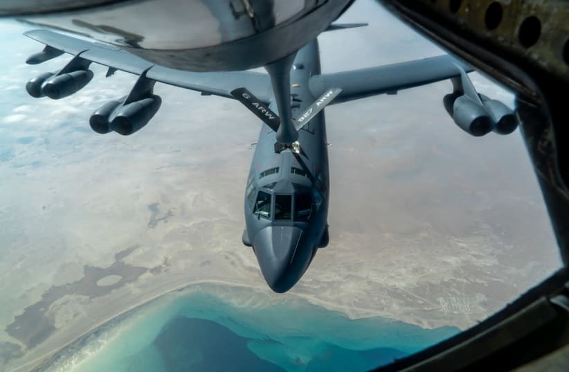 A U.S. Air Force B-52 from Minot Air Force Base is aerial refueled by a KC-135 Stratotanker over the U.S. Central Command area of responsibility Dec. 30, 2020. The B-52 Stratofortress is a long-range, heavy bomber that is capable of flying at high subsonic speeds at altitudes of up to 50,000 feet an (photo credit: U.S. AIR FORCE PHOTO BY SENIOR AIRMAN ROSLYN WARD)