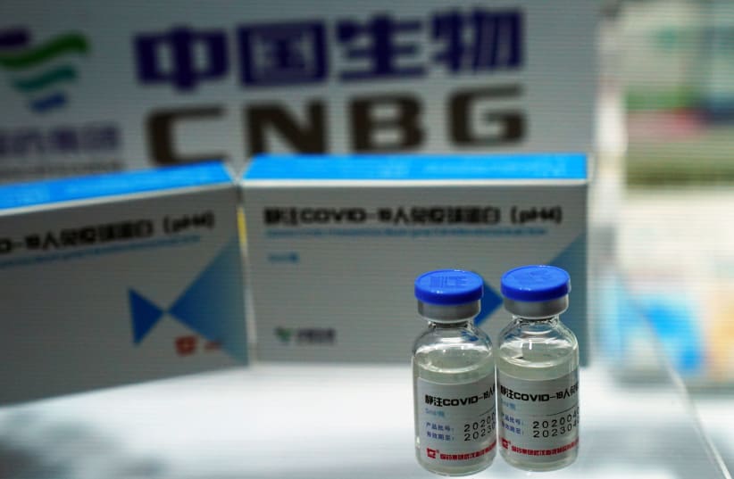 Booth displaying coronavirus vaccine candidate from CNBG, a unit of Sinopharm, in Beijing (photo credit: REUTERS/TINGSHU WANG)