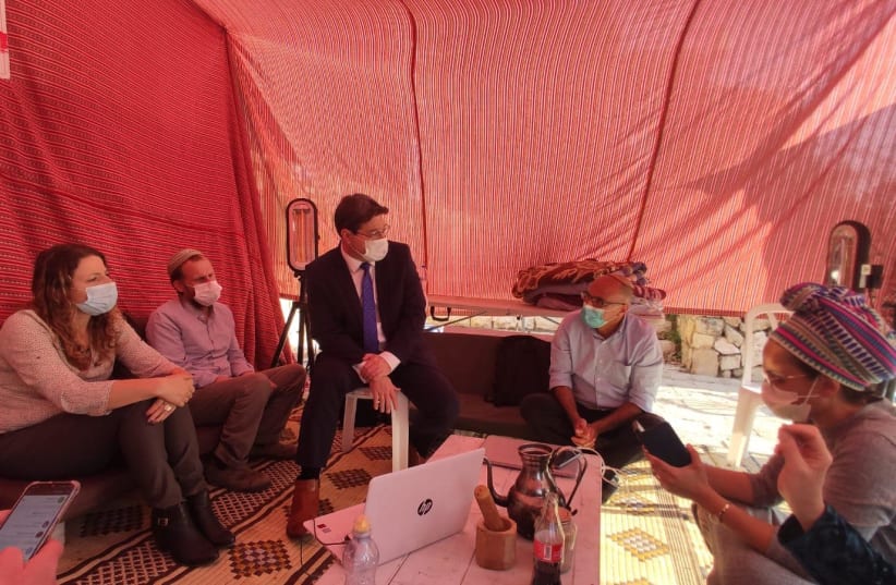 Regional Cooperation Minister Ofir Akunis is seen at the outpost protest encampment. (photo credit: COURTESY YOUNG SETTLEMENTS FORUM)