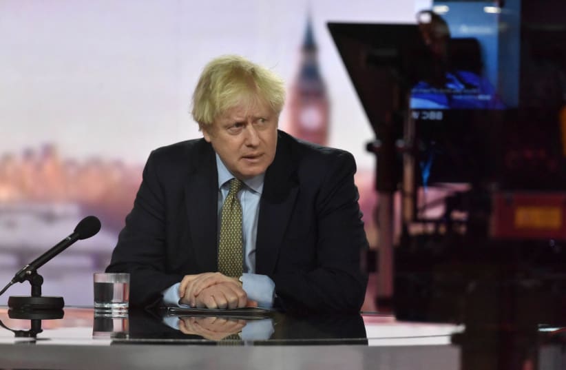 Britain's Prime Minister Boris Johnson appears on BBC TV's The Andrew Marr Show in London, UK, January 3, 2021 (photo credit: JEFF OVERS/BBC/HANDOUT VIA REUTERS)