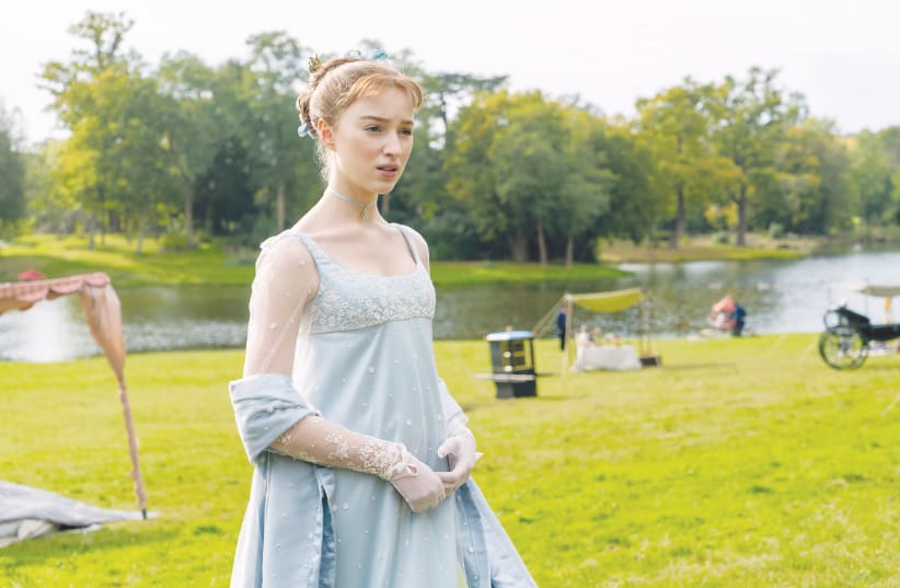 PHOEBE DYNEVOR stars as Daphne Bridgerton in ‘Bridgerton,’ a TV show primarily dedicated to the premise that the British aristocracy schemed and lied in order to marry for money.  (photo credit: LIAM DANIEL/NETFLIX)