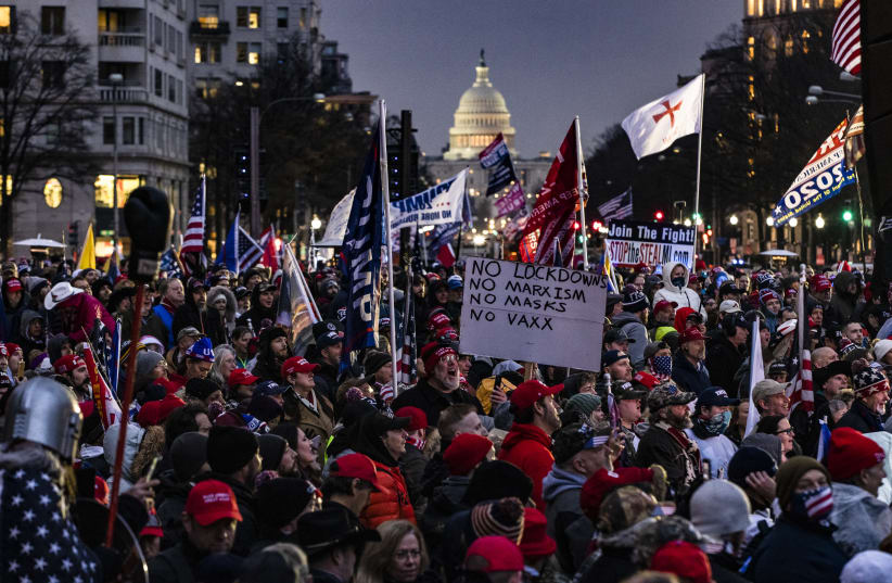Supporters of President Donald Trump gather for a rally at Freedom Plaza in Washington, DC on January 5, 2021. A string of extremists are expected at the rally. (Samuel Corum/Getty Images) (photo credit: SAMUEL CORUM/GETTY IMAGES)