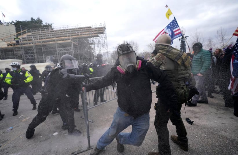 Protesters and police clash at the foot of the US Capitol, January 6, 2021.  (photo credit: Courtesy)