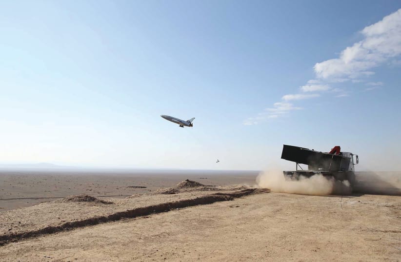 A drone is being launched during a large-scale drone combat exercise of Army of the Islamic Republic of Iran, in Semnan, Iran January 6, 2021. (photo credit: IRANIAN ARMY/WANA (WEST ASIA NEWS AGENCY)/HANDOUT VIA REUTERS)