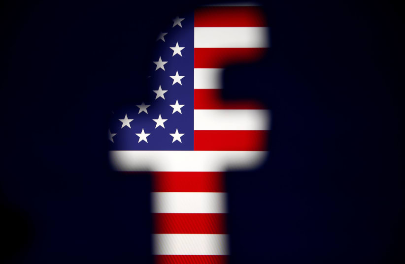 A 3D-printed Facebook logo is displayed in front of a US flag in this illustration taken, March 18, 2018. (photo credit: REUTERS/DADO RUVIC/ILLUSTRATION)