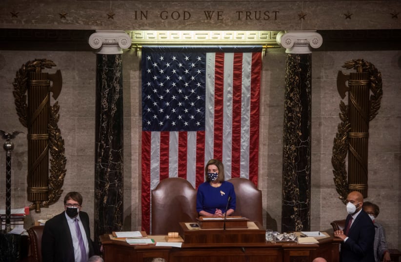 House Speaker Nancy Pelosi (D-CA) speaks as Congress reconvenes in the House chamber to debate Arizona's certification of electoral college votes at the US Capitol in Washington, US, January 6, 2021 (photo credit: AMANDA VOISARD/POOL VIA REUTERS)