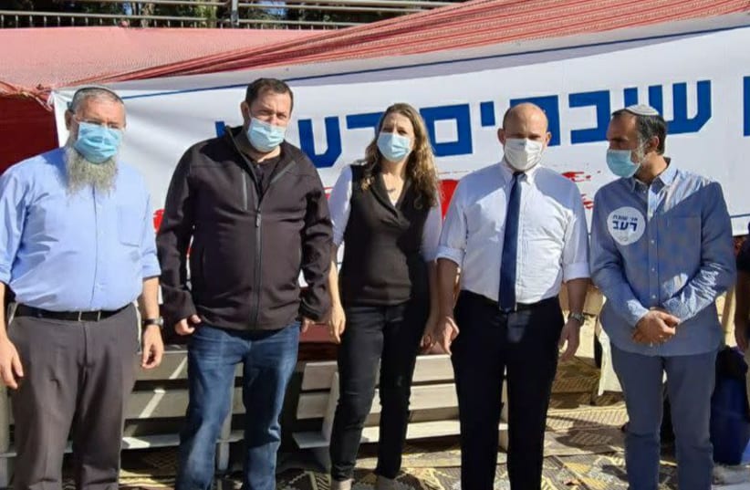 Naftali Bennett (second from left) is seen at the outpost protest encampment. (photo credit: ROEE HADI)