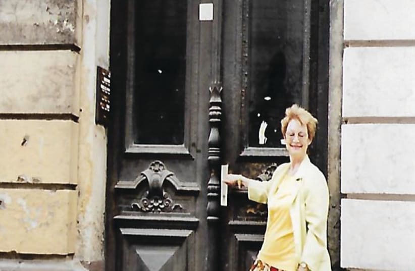 The writer standing in front of the house in Leipzig from which her family fled on Kristallnacht. (photo credit: Courtesy)