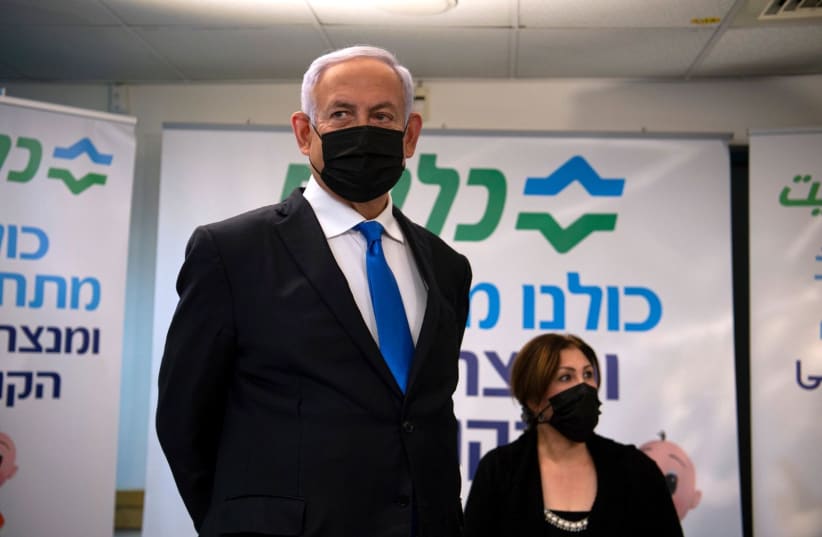 Prime Minister Benjamin Netanyahu is seen at a Clalit clinic in Nazereth. (photo credit: GIL ELIYAHU/HAARETZ/POOL)