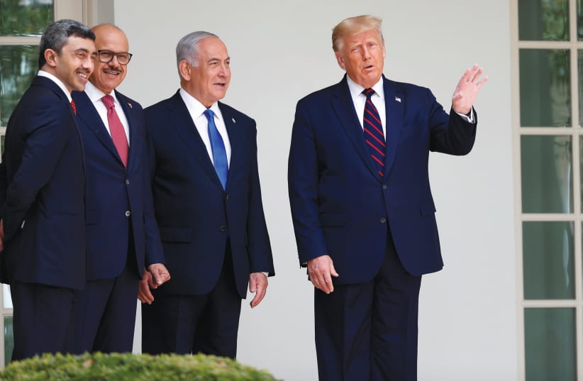 US PRESIDENT Donald Trump talks with UAE Foreign Minister Abdullah bin Zayed, Bahrain’s Foreign Minister Abdullatif Al Zayani and Prime Minister Benjamin Netanyahu before the September signing of the Abraham Accords on the South Lawn of the White House in Washington. (photo credit: TOM BRENNER/REUTERS)