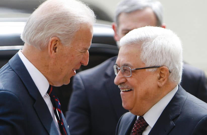 PALESTINIAN AUTHORITY President Mahmoud Abbas (right) greets then-US vice president Joe Biden in 2010. Abbas seized upon the election of Biden as an opportunity to position himself as a positive actor. (photo credit: MOHAMAD TOROKMAN/REUTERS)