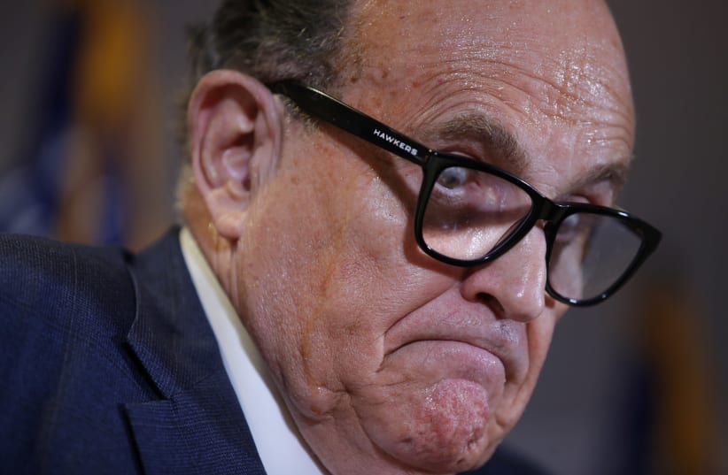 Former New York City Mayor Rudy Giuliani, personal attorney to US President Donald Trump, speaks during a news conference about the 2020 U.S. presidential election results held at Republican National Committee headquarters in Washington, US, November 19, 2020. (photo credit: REUTERS/JONATHAN ERNST)