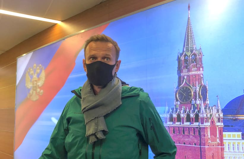 Russian opposition leader Alexei Navalny speaks with journalists upon the arrival at Sheremetyevo airport in Moscow, Russia January 17, 2021.  (photo credit: REUTERS/POLINA IVANOVA)