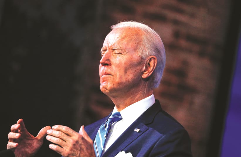 JOE BIDEN reacts while delivering remarks last week at The Queen theater in Wilmington, Delaware during a televised speech on the current economic and health crises. (photo credit: TOM BRENNER/REUTERS)