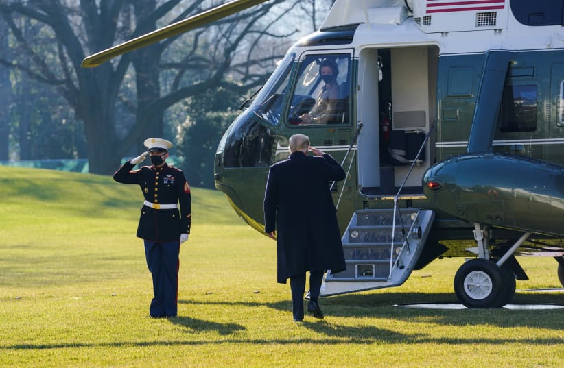 US President Donald Trump boards Marine One as he departs the White House on travel to visit the US-Mexico border Wall in Texas, in Washington, US, January 12, 2021.  (photo credit: REUTERS/KEVIN LAMARQUE/FILE PHOTO)