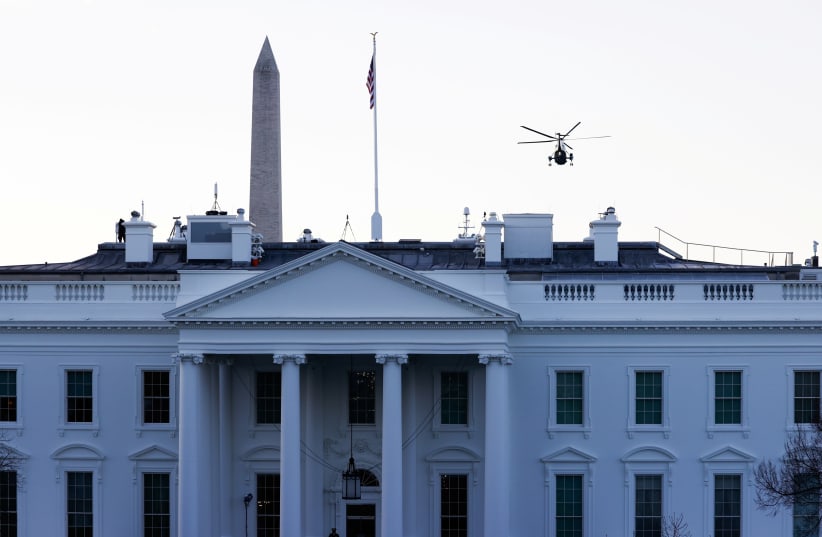 US President Donald Trump departs the White House aboard Marine One ahead of the inauguration of President-elect Joe Biden, in Washington, US, January 20, 2021. (photo credit: ANDREW KELLY / REUTERS)