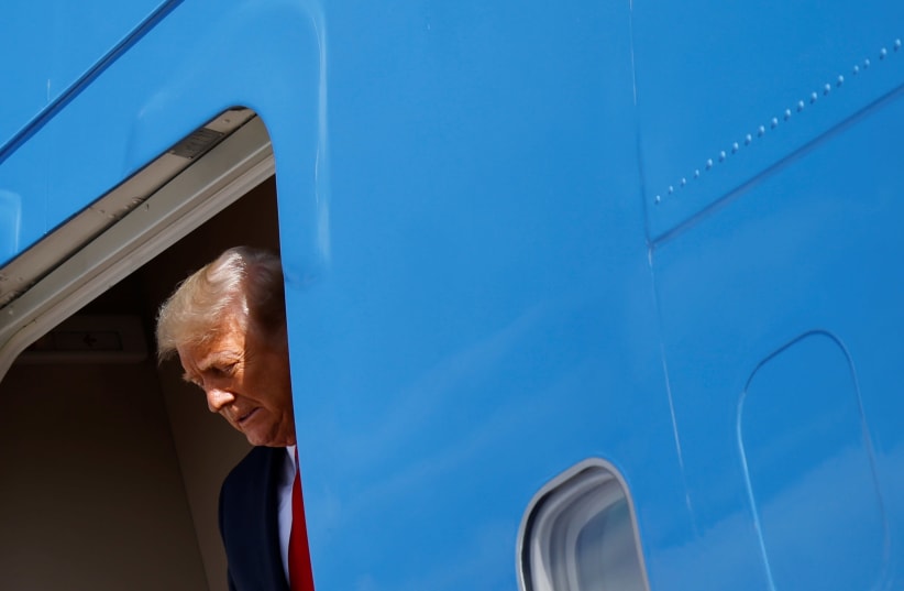 U.S. President Donald Trump disembarks a plane as he arrives at Palm Beach International Airport in West Palm Beach, Florida, U.S., January 20, 2021. (photo credit: CARLOS BARRIA / REUTERS)