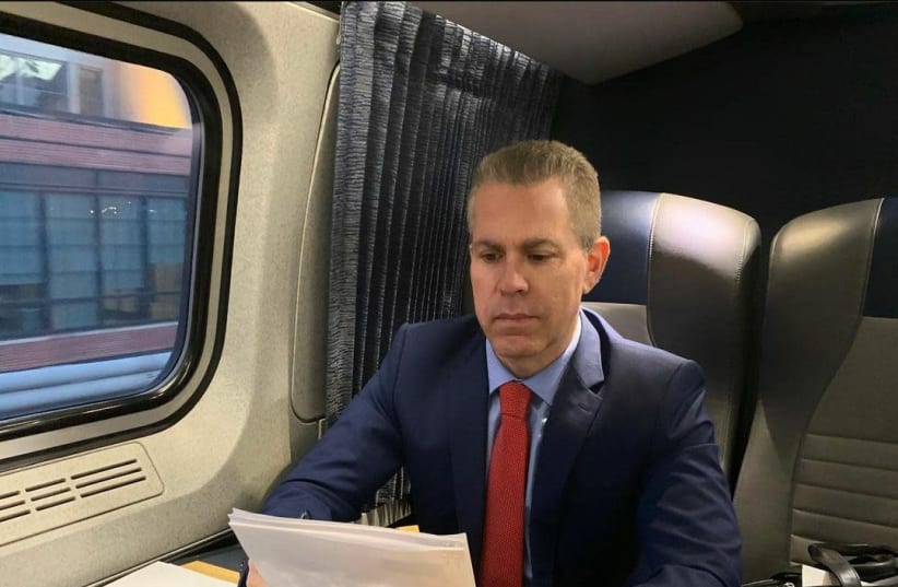 Israeli Ambassador to the UN Gilad Erdan working on a train. Erdan met US President Joe Biden on the train and discussed Israel-US relations. (photo credit: Courtesy)