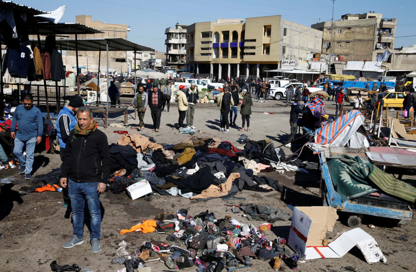 The site of a twin suicide bombing attack in a central market is seen in Baghdad (photo credit: REUTERS)