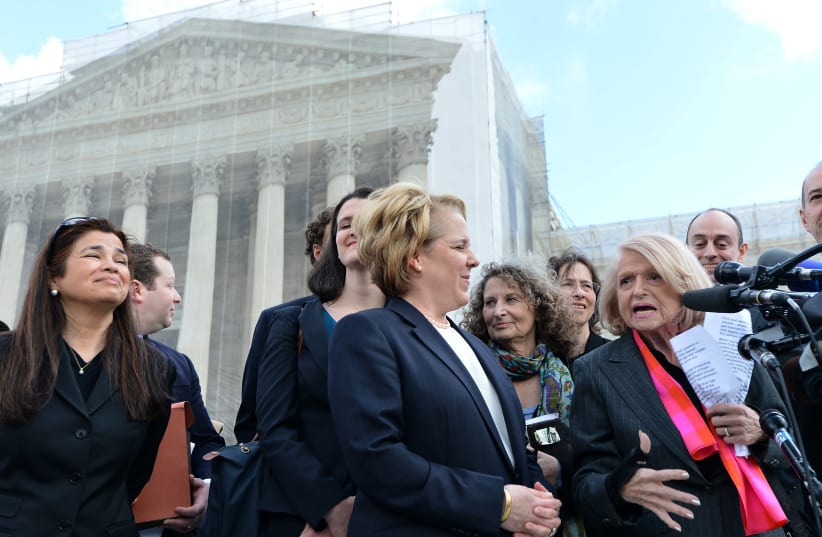 Edie Windsor, right, an 83-year-old lesbian widower, makes a statement to the media as her lawyer Roberta Kaplan, left, looks on in front of the Supreme Court in Washington, March 27, 2013. (photo credit: AFP/JEWEL SAMAD VIA GETTY IMAGES)