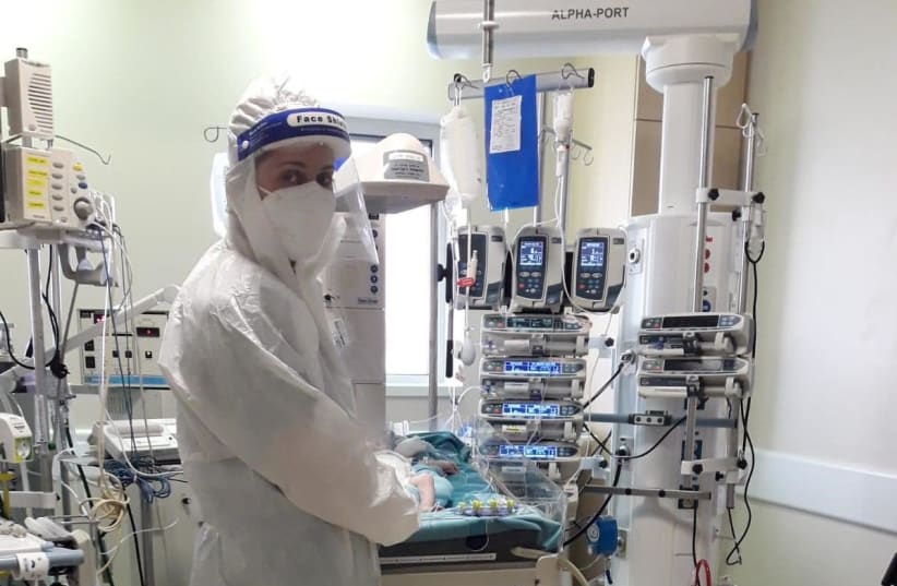 A nurse works in the new COVID-19 ICU for children at Hadassah-University Medical Center (photo credit: Courtesy)