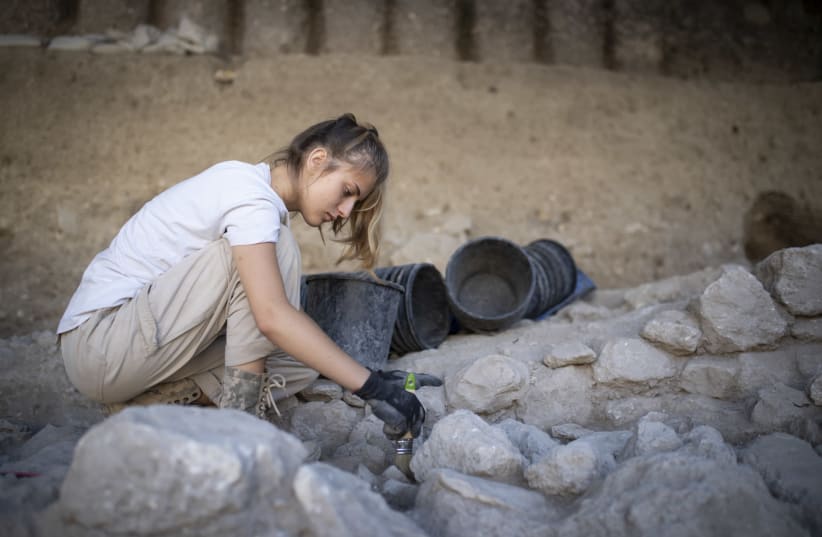Valeria Fenik works at a digging site in the Givati Parking Lot excavation grounds, at the City of David National Park, on July 22, 2019. The most recent digging site currently under work is attributed to the Muslim, Byzantine, and early Roman periods.  (photo credit: HADAS PARUSH/FLASH90)