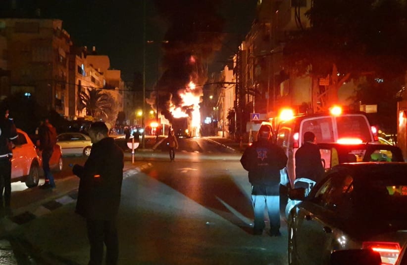 Haredi rioters torch bus in Bnei Brak, Jan. 24, 2021 (photo credit: MOTTI UNNA/MDA)
