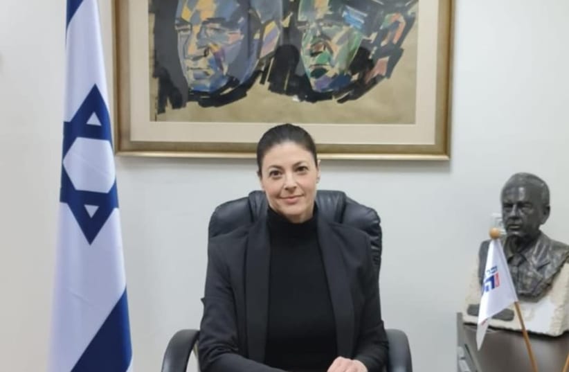 Merav Michaeli sitting on the party leader's chair at her office in Tel Aviv (photo credit: MICHAELI'S OFFICE)