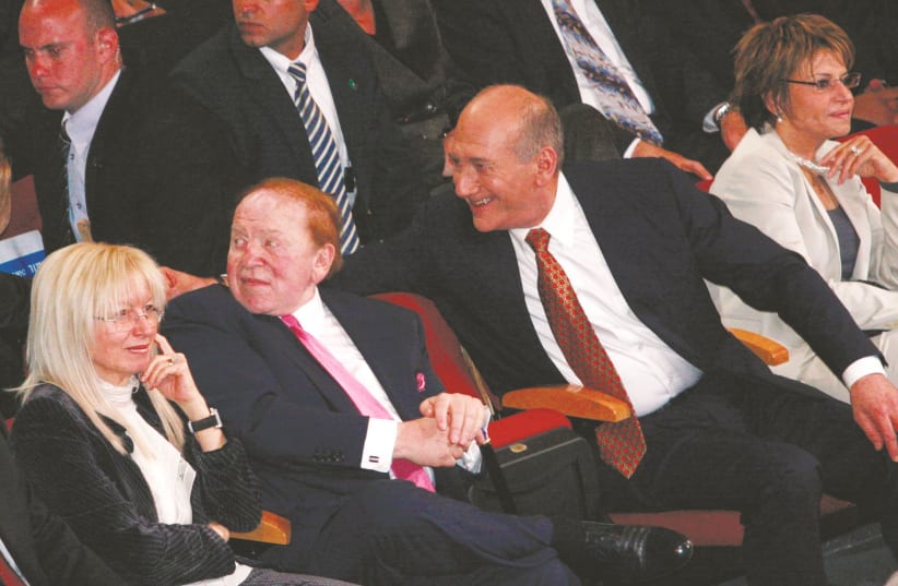 SHELDON ADELSON (center), his wife Miriam, and then-prime minister Ehud Olmert attend a conference in Jerusalem in 2008. (photo credit: OLIVIER FITOUSSI/FLASH90)